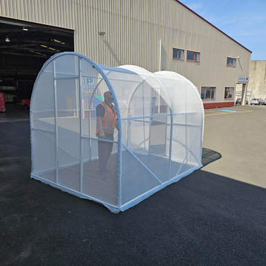Backend of Shade House with white shade cloth and door open